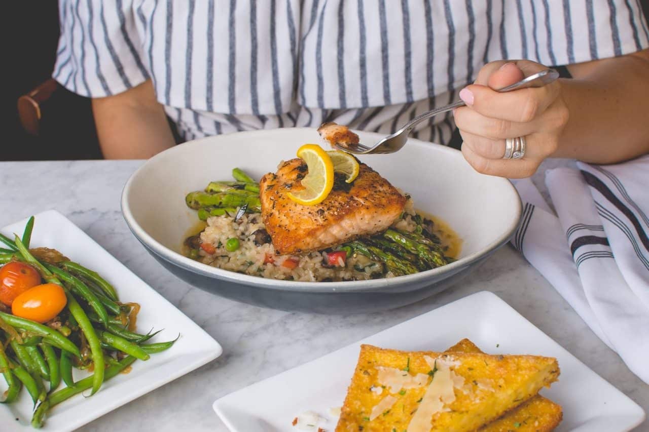 A plate with a cooked fish dinner.