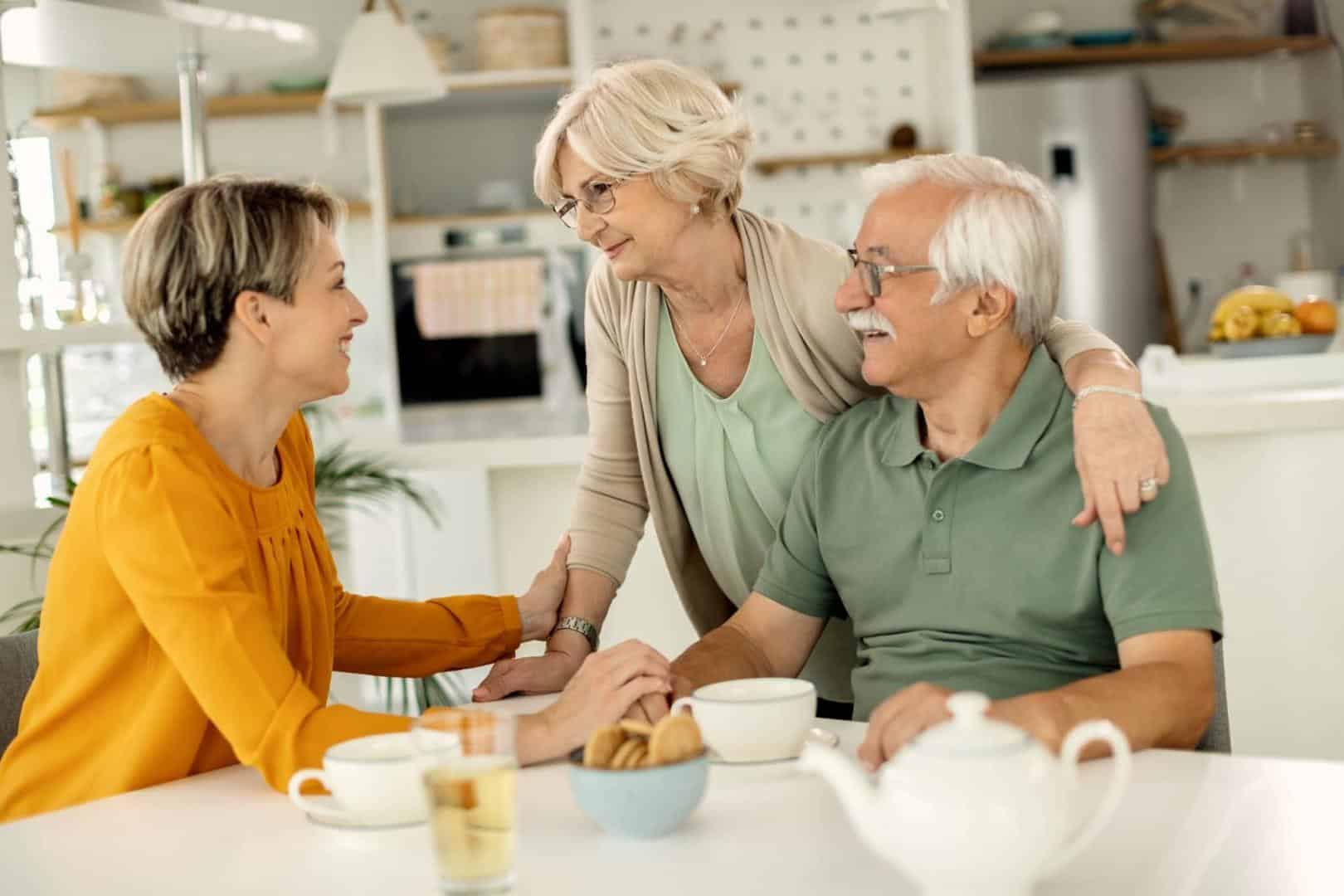 Adult daughter enjoying a pleasant chat with her parents.