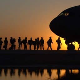 Soldiers boarding a plane.