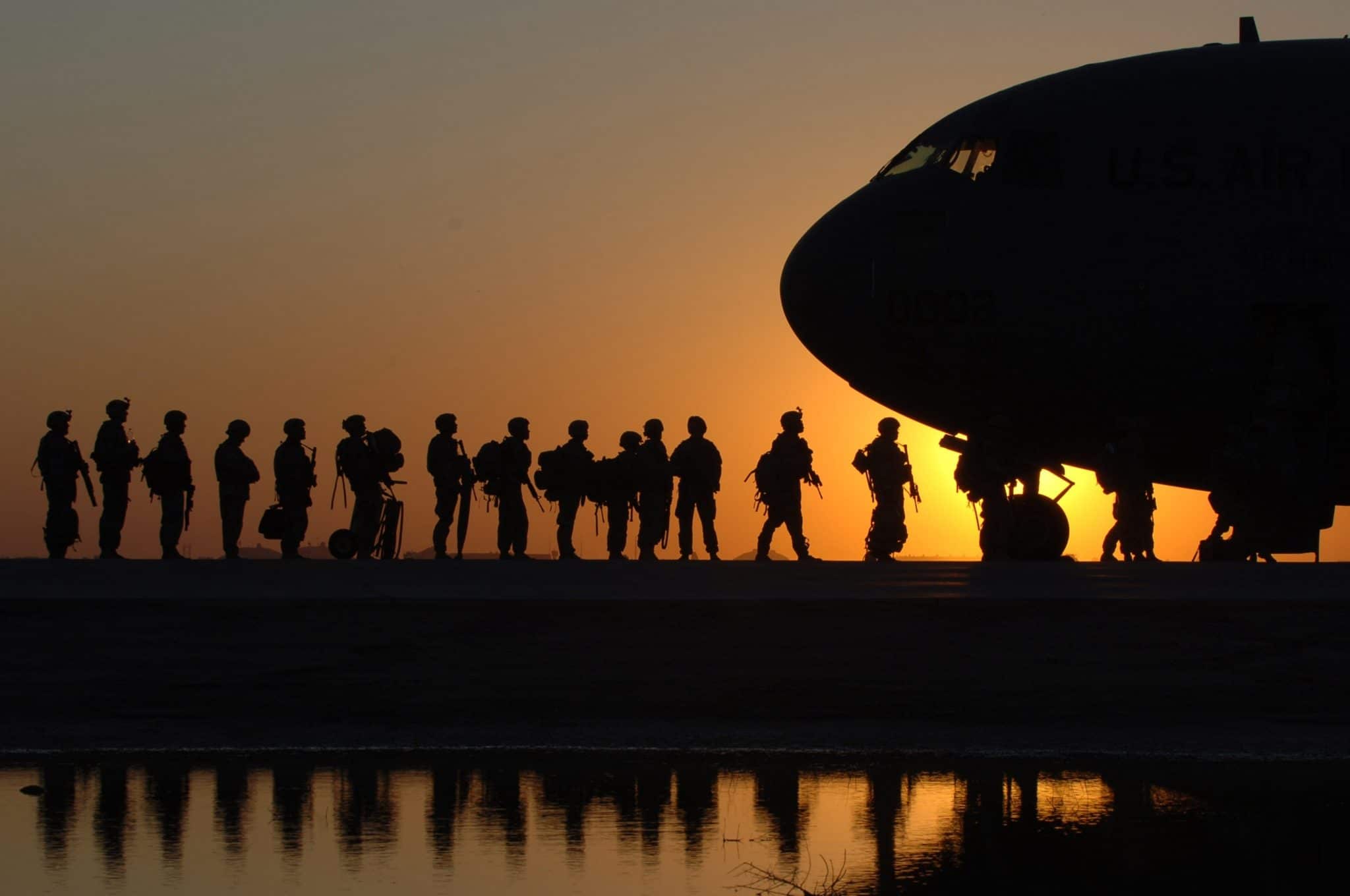 Soldiers boarding a plane.