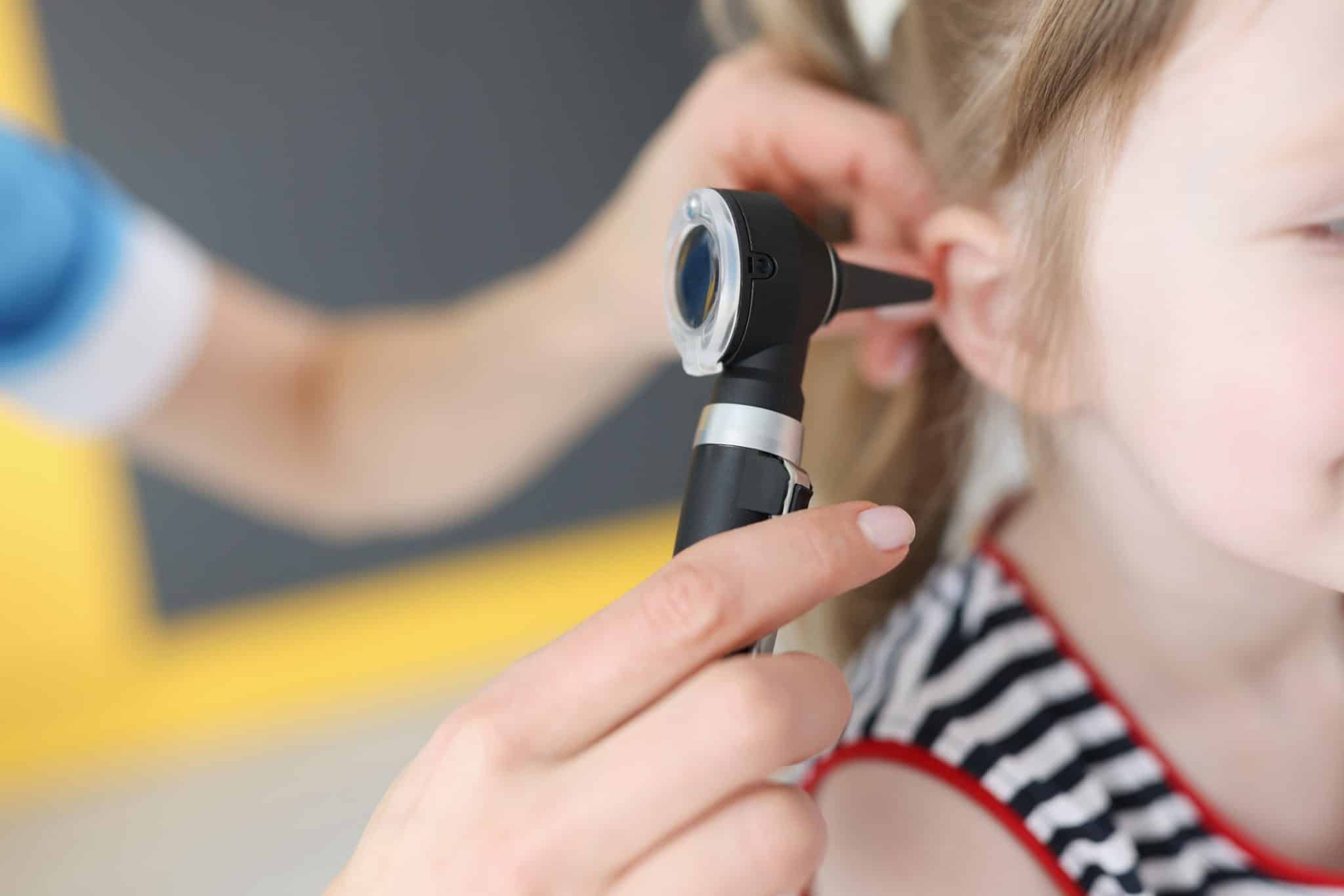 Little girl having an ear exam.