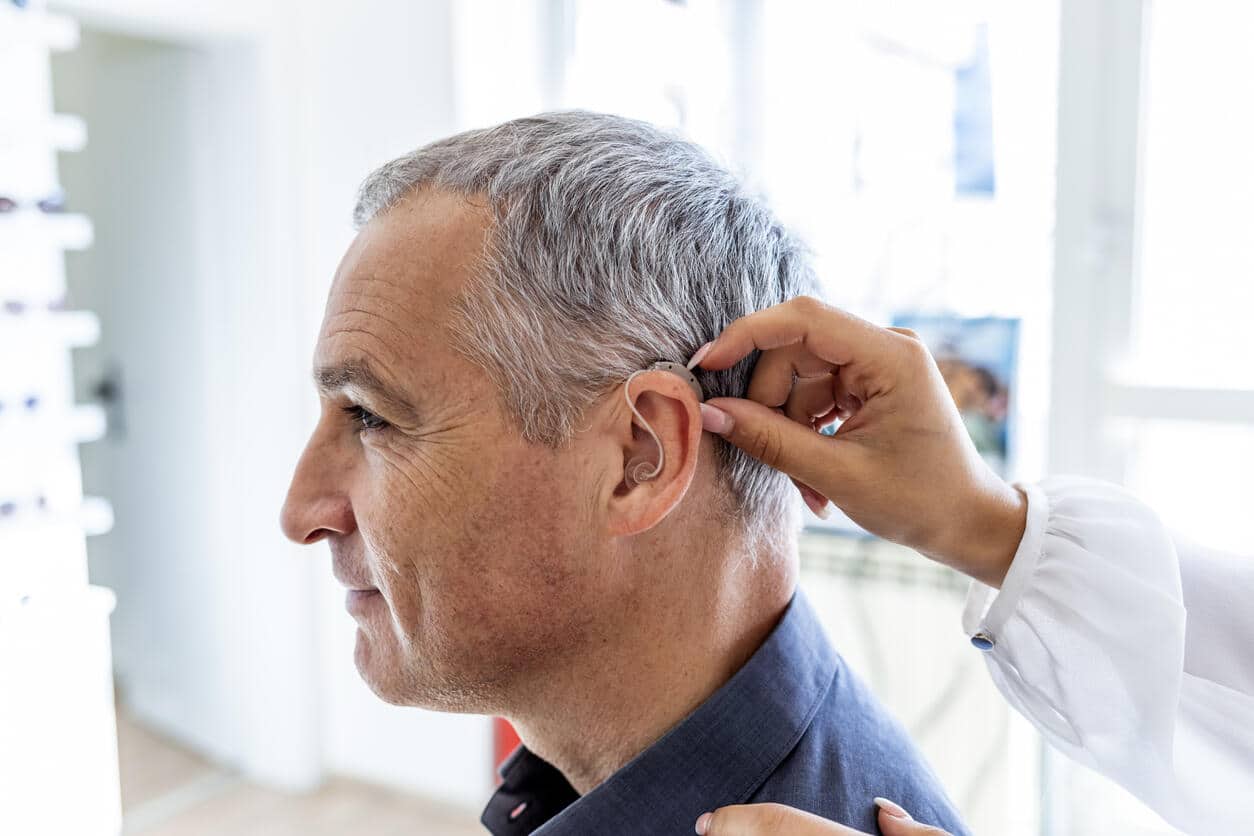 Man sees doctor about hearing aid